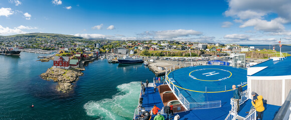 View from ferry on Torshavn harbor and Tinganes, the historic location of the Faroese government in Torshavn, the Faroe Islands.