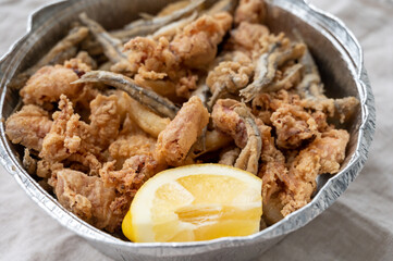 Spanish sea food, cripsy deep fried baby octopus, fish, calamari rings served with lemon