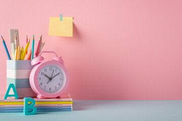 Back to school concept. Photo of school supplies on blue desk stand for pencils alarm clock plastic...