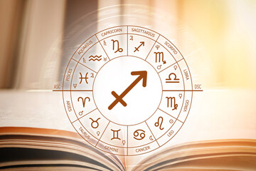Zodiac circle against the background of an open book with Sagittarius sign