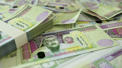 close up of Mongolian togrog notes spread on table. 3d rendering of money scattered on surface