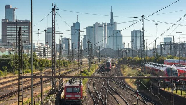 Frankfurt skyline with train lines towards HBF (Central Station), Sunny day, time lapse