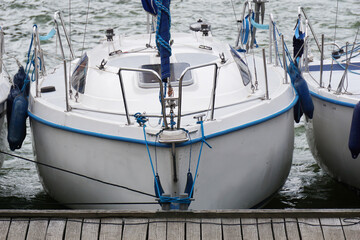Sailboat moored in port - front view