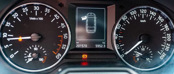 Modern car speedometer,odometer,tachometer and illuminated dashboard. car dashboard modern automobile controlilluminated panel speed display.Car instrument panel.Close up.Selective focus.