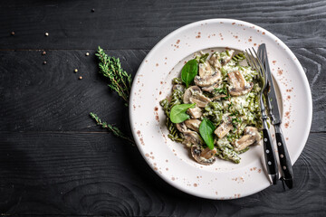 Mushroom and Spinach Pasta in a Bowl, Vegan Food on light background. Vegan or gluten free diet. banner, menu recipe place for text, top view