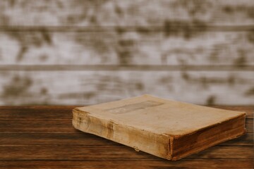 Fototapeta premium A retro old book on a wooden table.