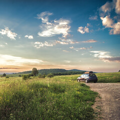 Offroad car for traveling with a roof rack at mountain road. 