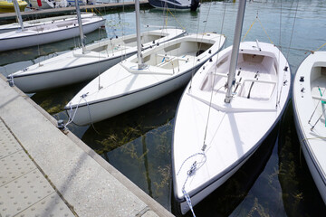 Fototapeta premium White sailboats moored in port