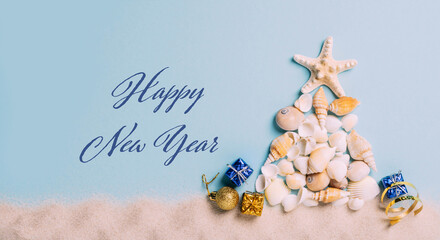 Creative Christmas tree from sea shells, small gifts blue background, text Happy New Year