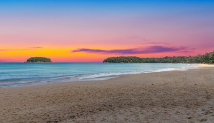 Colourful Skies Sunset over Kata Beach in Phuket Thailand. This Lovely island waters are turquoise...