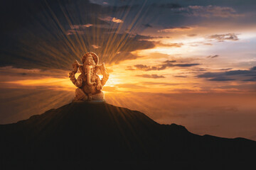 Lord ganesha sculpture on sun light background. - obrazy, fototapety, plakaty