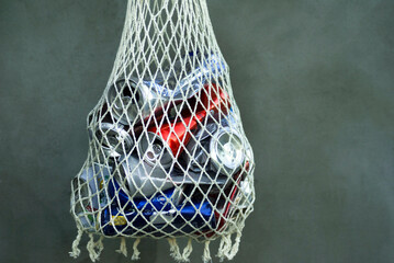 Drink cans crumpled and folded into a rag net for disposal