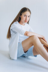 Fototapeta premium Young blondie caucasian girl on white background. Natural beauty, no make up, casual lifestyle girl