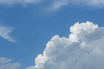Naklejka na ściany i meble White clouds weather change wind against blue sky nature atmosphere