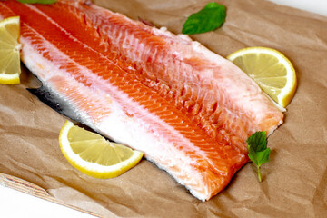 fresh raw salmon on cooking paper