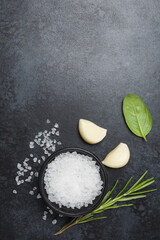 Food background from vegetable, spices, herb on black table.