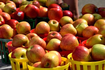 Fresh red apples for sale at outdoor market place.