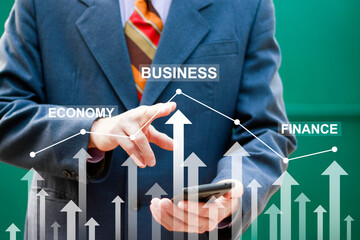 Businessman pointing arrow graph corporate future growth plan. Business development to success and business growing concept.