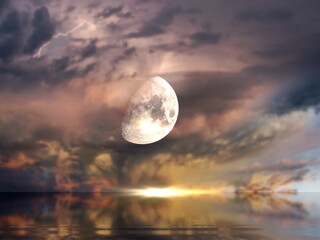  big moon  on stormy dramatic sky pink cloudy sunset at sea pastel color sun beam seascape nature landscape.