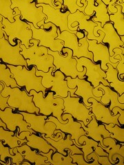 patterns and design inspired by vivid yellow foam ball in a black net