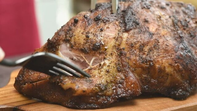 Freshly roasted pork shoulder, close-up.
