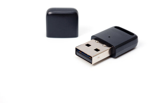 Adapter for wireless connection of various devices with a computer. Plastic, black with protective cap.