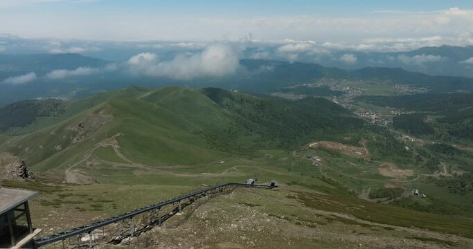 Didveli Ski Resort Inclined Elevator Tracks On Slope To Tskhratskaro Pass At Summer In Georgia. - aerial pullback