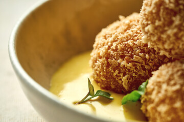 Croquette with shrimp in cheese sauce. Close-up selective focus