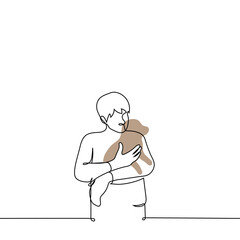 man stands holding a puppy in his arms - one line drawing vector. the concept of a dog lover, the owner of the dog lovingly holds and cuddles the pet