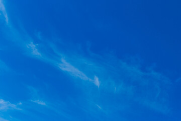 Bright blue sky in the evening with white soft clouds natural background weather air