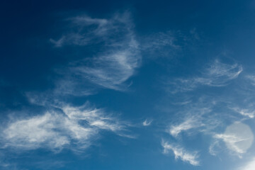Naklejka na ściany i meble Dark blue sky atmosphere with white air clouds weather wind nature background