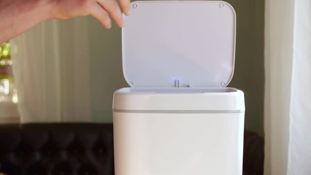 Household electrical appliances waste. E-waste recycle. Contactless Smart Touch Trash Can