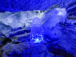 Trekking in a dark ice cave
