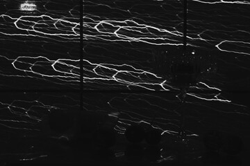 Abstract drawing of lights on the wall. black and white color palette. photo texture.