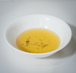 White cup with used vegetable oil.