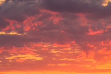 Naklejka na ściany i meble Bright red-orange sunset sky clouds summer background nature evening