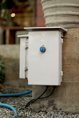 Waterproof cable storage box installed in a loop that controls the on-off of electricity.