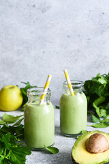 Green, vegetable smoothie with parsley, celery and avocado.