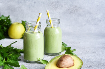 Green, vegetable smoothie with parsley, celery and avocado.