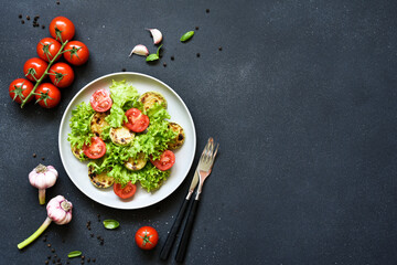 Vegetarian salad with zucchini and tomatoes, top view
