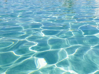 Seascape. Mediterranean Sea. Water ripple. Blue transparent water sparkles with glare in the sun. Cyprus