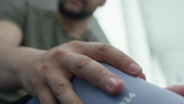 Close up view of man with below knee amputation putting on prosthetic socket