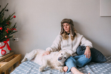 Portrait of a woman and her life-style labrador retriever at home