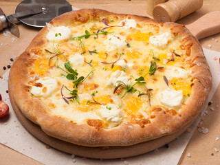 pizza four cheeses on a wooden board in a restaurant