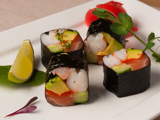 sushi rolls without rice with salmon, shrimp, avocado cucumber and caviar