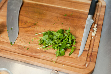 The cook cuts vegetables with a knife to prepare the dish. Cutting vegetables.