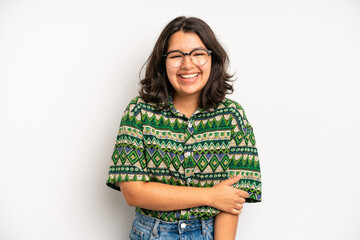 hispanic pretty woman laughing shyly and cheerfully, with a friendly and positive but insecure...