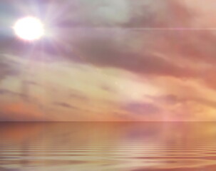  sun flares on orange   sky  yellow gold orange clouds sunset sun beam light at sea water wave reflection