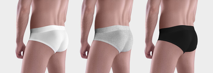 Mockup of white, black, heather underpants on a guy with a shaved body, back, side view, isolated...