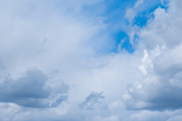Naklejka na ściany i meble White cumulus clouds blue sky natural background weather change wind